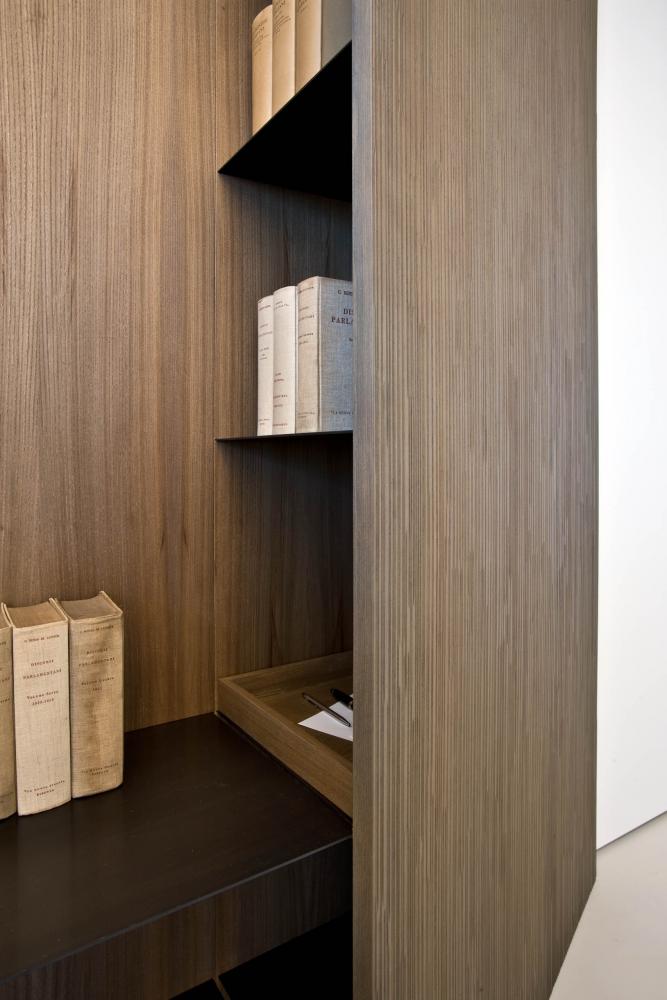 laurameroni detail of luxury custom book case with metal shelves for ceo office in elm wood
