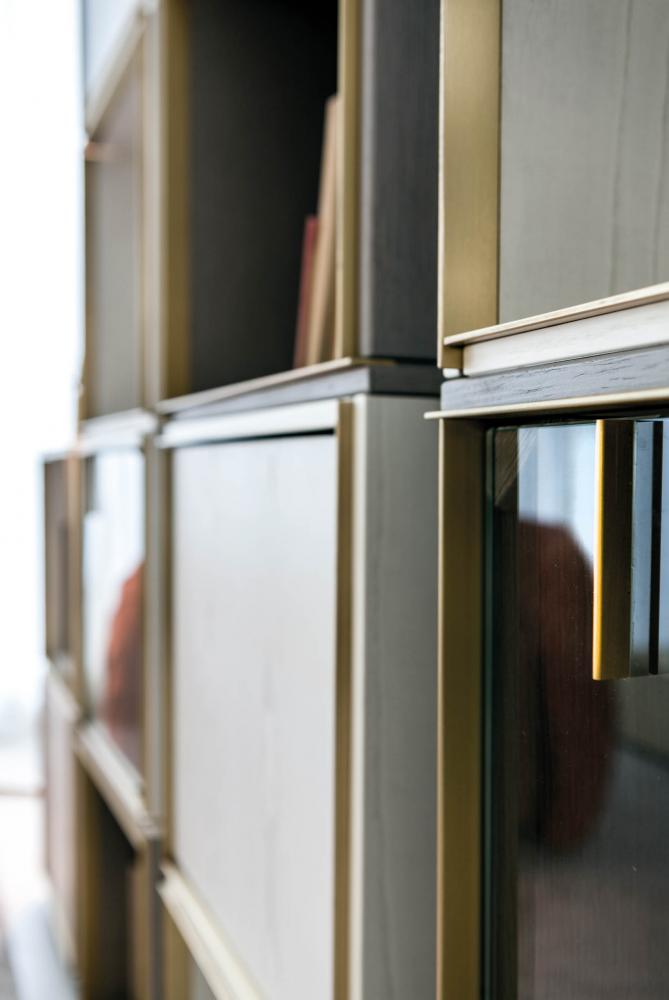 Modular luxury storage unit with brass frame white wood structure and glass doors