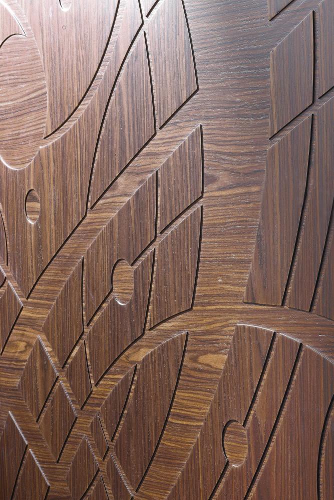 Laurameroni Graffiti Cabinet System made to measure artisanal, luxury day wardrobes in carved materic wood
