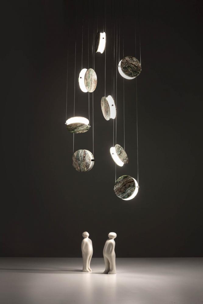 cascade of modern cirucular led suspension light in onyx marble