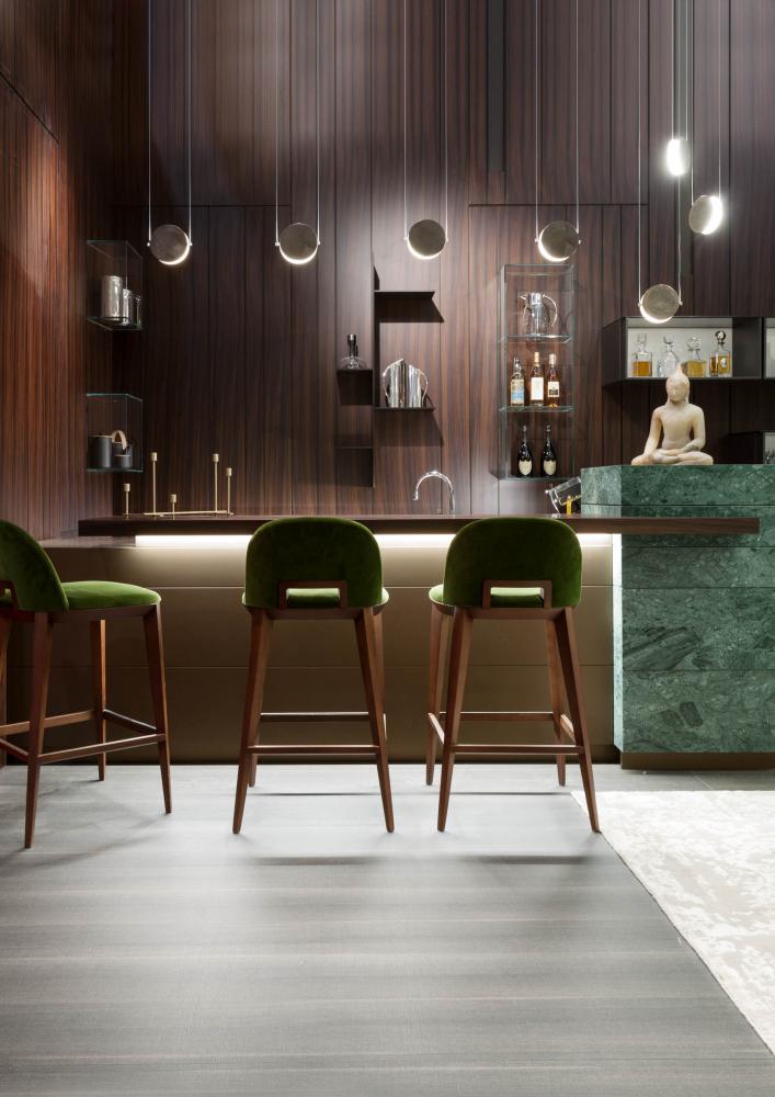 modern luxury home bar area with suspension lamps and rosewood wall panels