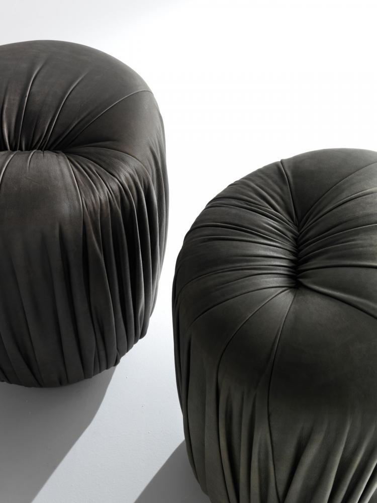 Drapè Poufs are leather or velvet luxury ottomans with pleats