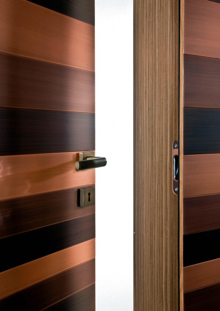 Stars custom made luxury wardrobe in wood with metal clad hinged doors
