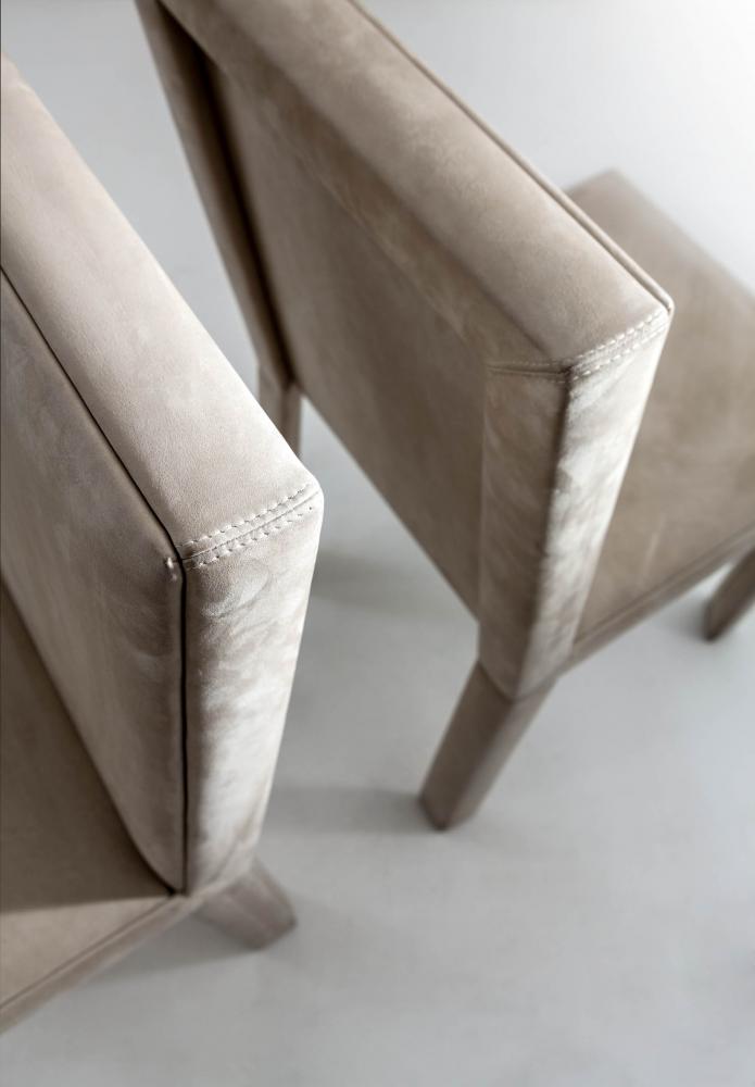 Modern chair with wooden structure covered with fabric or leather