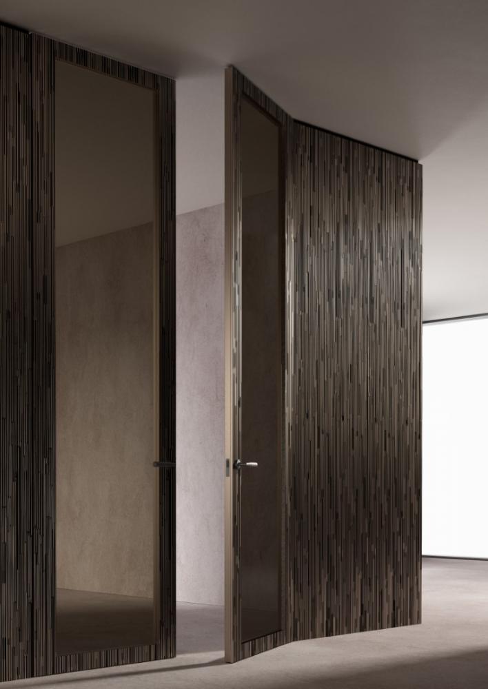 laurameroni custom made wall panels and integrated door in liquid metal decor