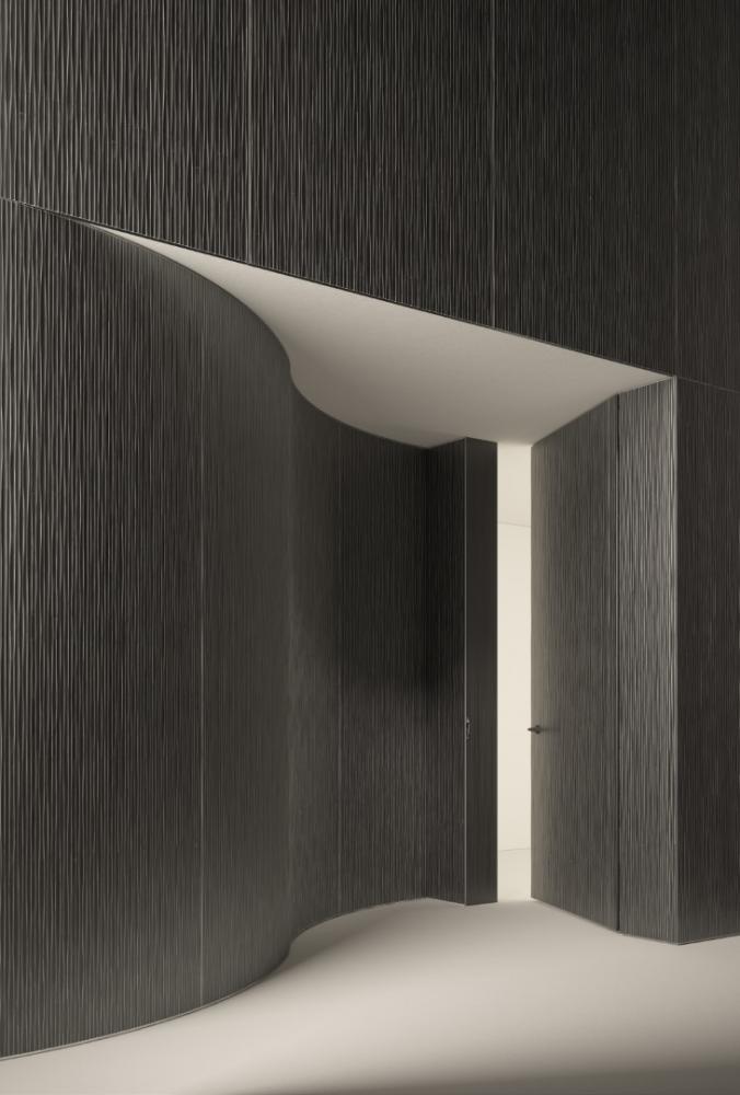laurameroni hinged door integrated into made to measure wall panels in wood