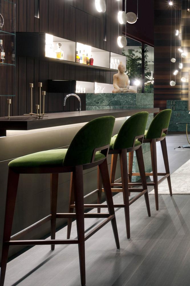 Margaret modern bar stool with wood structure upholstered in green velvet