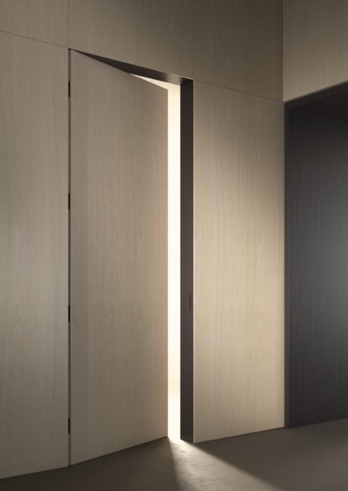 laurameroni customizable integrated hinged door in plain wood