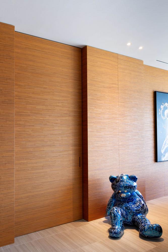 laurameroni decor textured wall panels and integrated door in carved teak wood