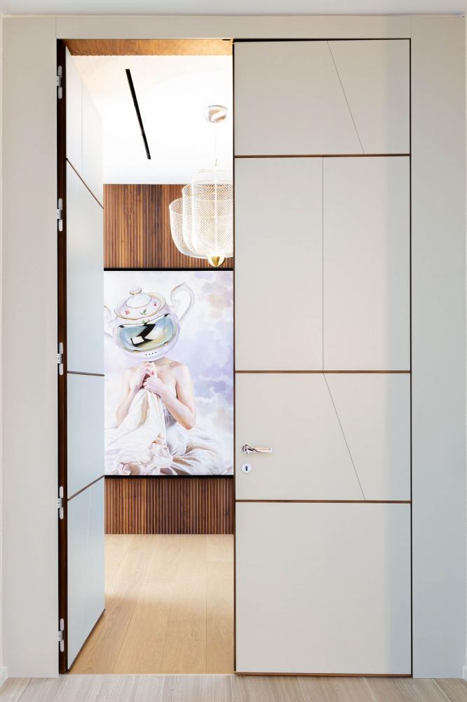 terre doucle leaf hinged door in textured white lacquered wood