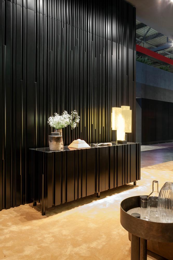 laurameroni textured wooden wall panels and black sideboard
