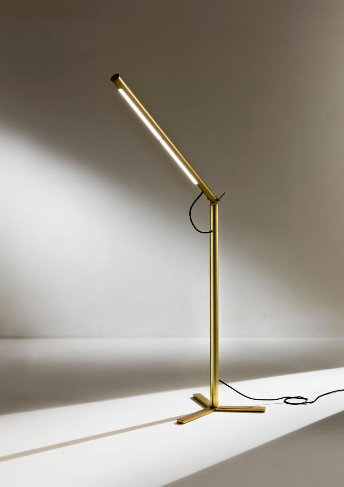 Modern cylindrical floor lamp in satin brass