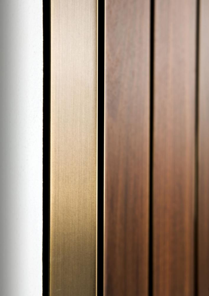 Custom made luxury hinged door in wood with brass profiles