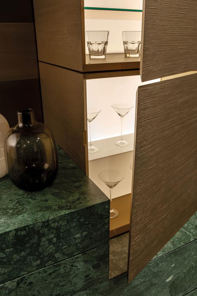 modular luxury storage system configured as a bar cabinet in green marble and special lacquered surface